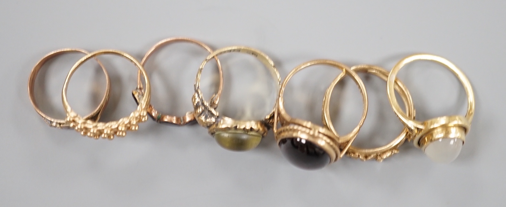 Six assorted Victorian and later 9ct gold or 9ct gold and gem set dress rings, including cabochon garnet and foliate band and a yellow metal and moonstone ring.